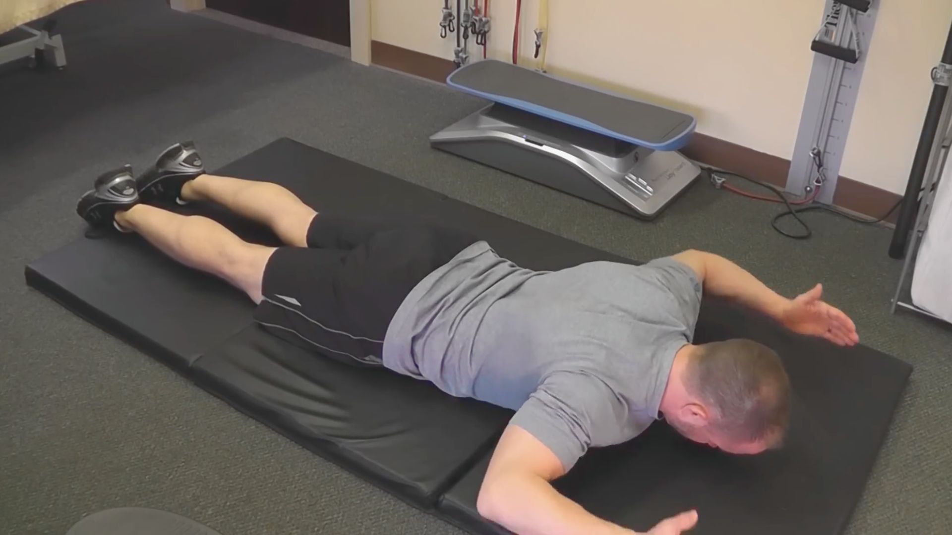 5. Standing Scapular Retraction (T Raises)