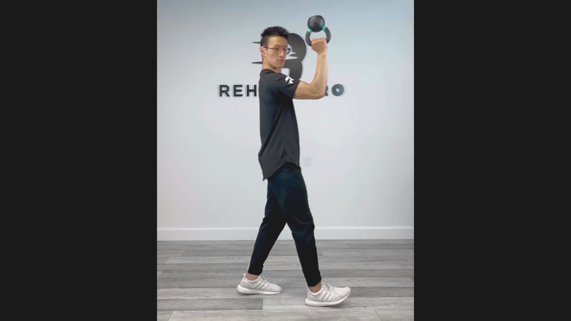 9. Kettlebell Carry with Neck Rotation