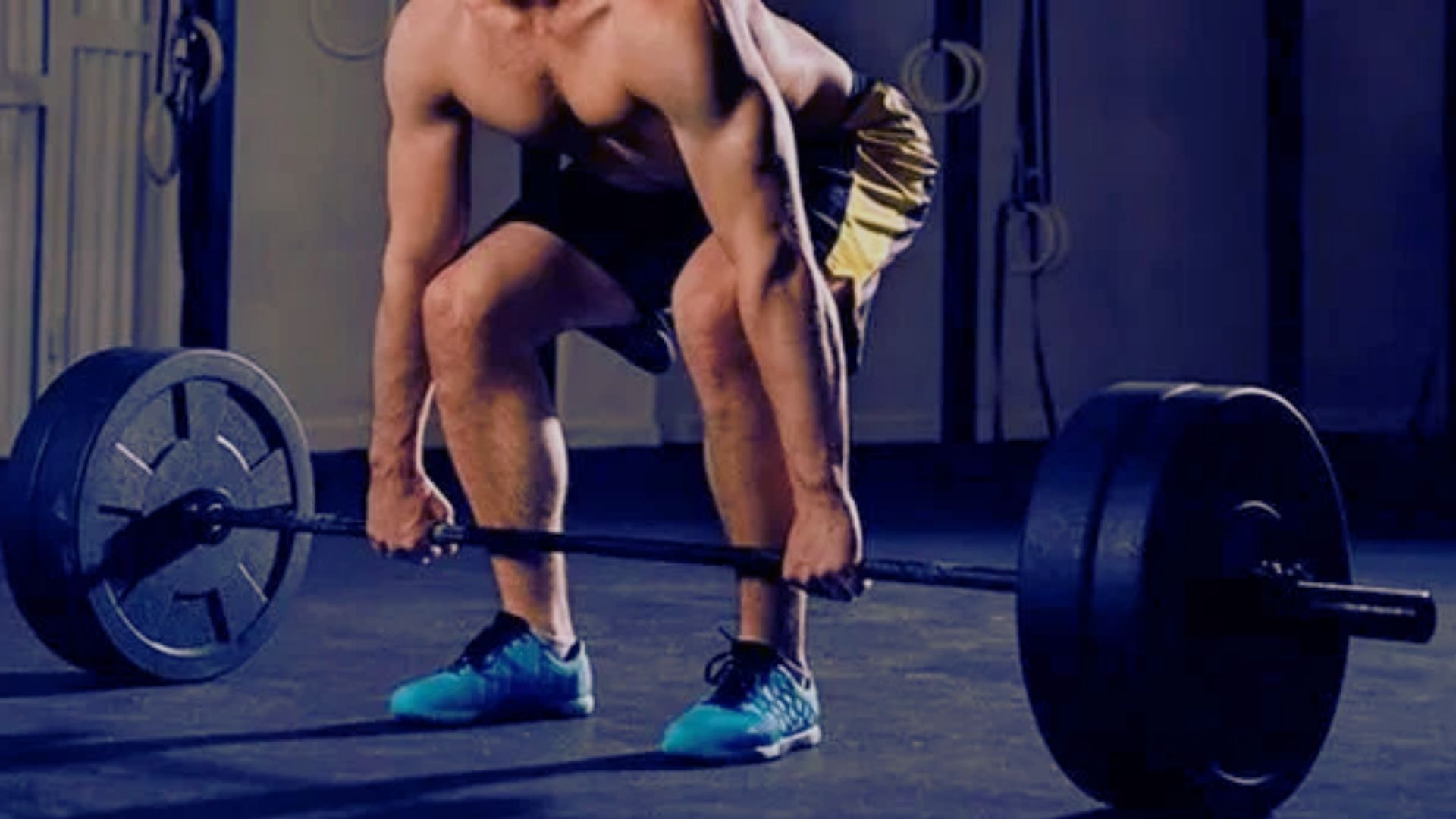 A black barbell resting on a black barbell, illustrating a 315-pound deadlift setup.