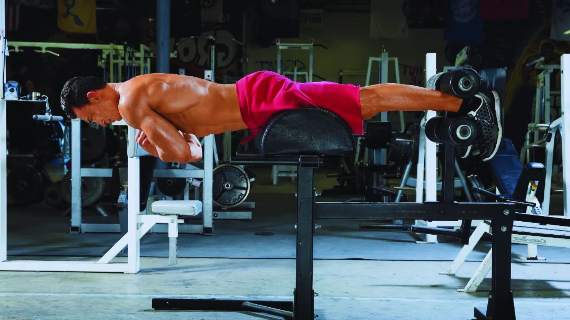 A man performing a push-up on a bench, demonstrating strength training and fitness technique.