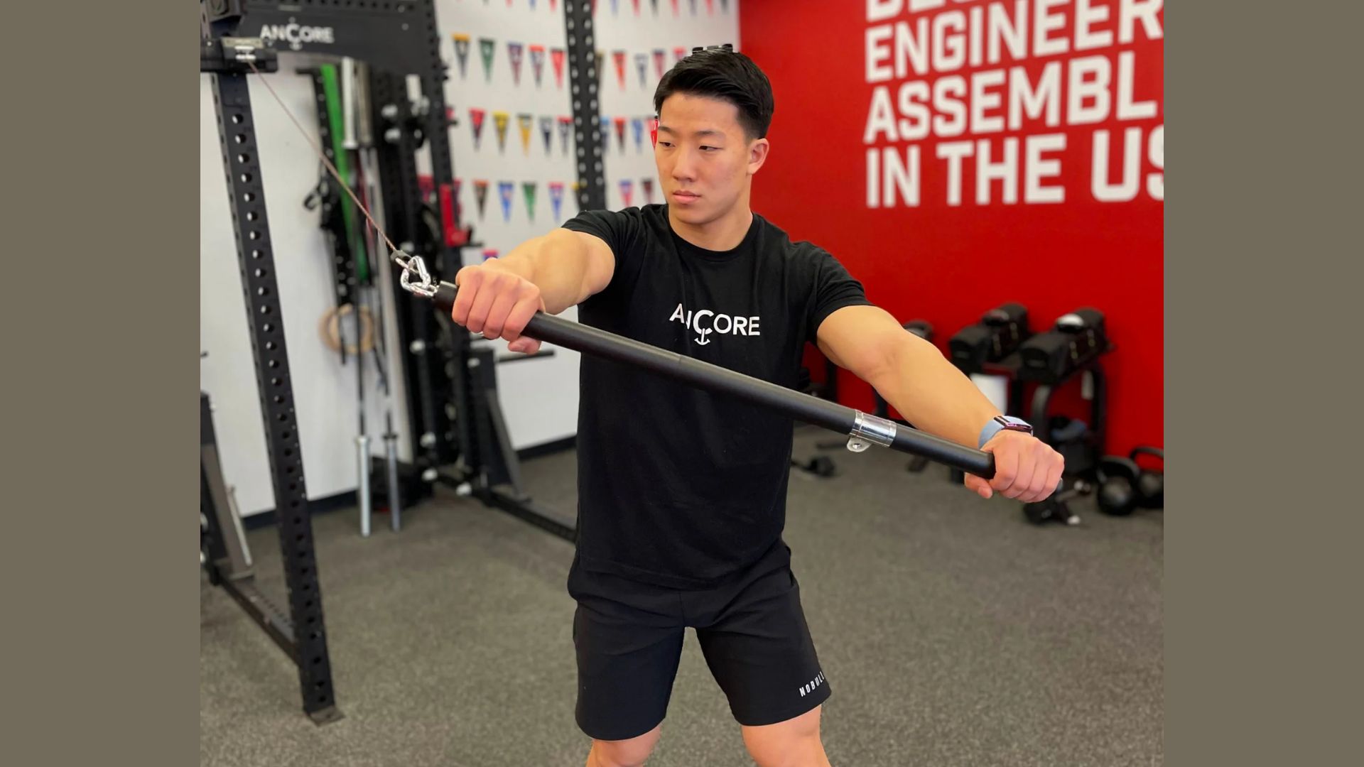 A man lifts a barbell in a gym, showcasing strength and focus during his workout session.