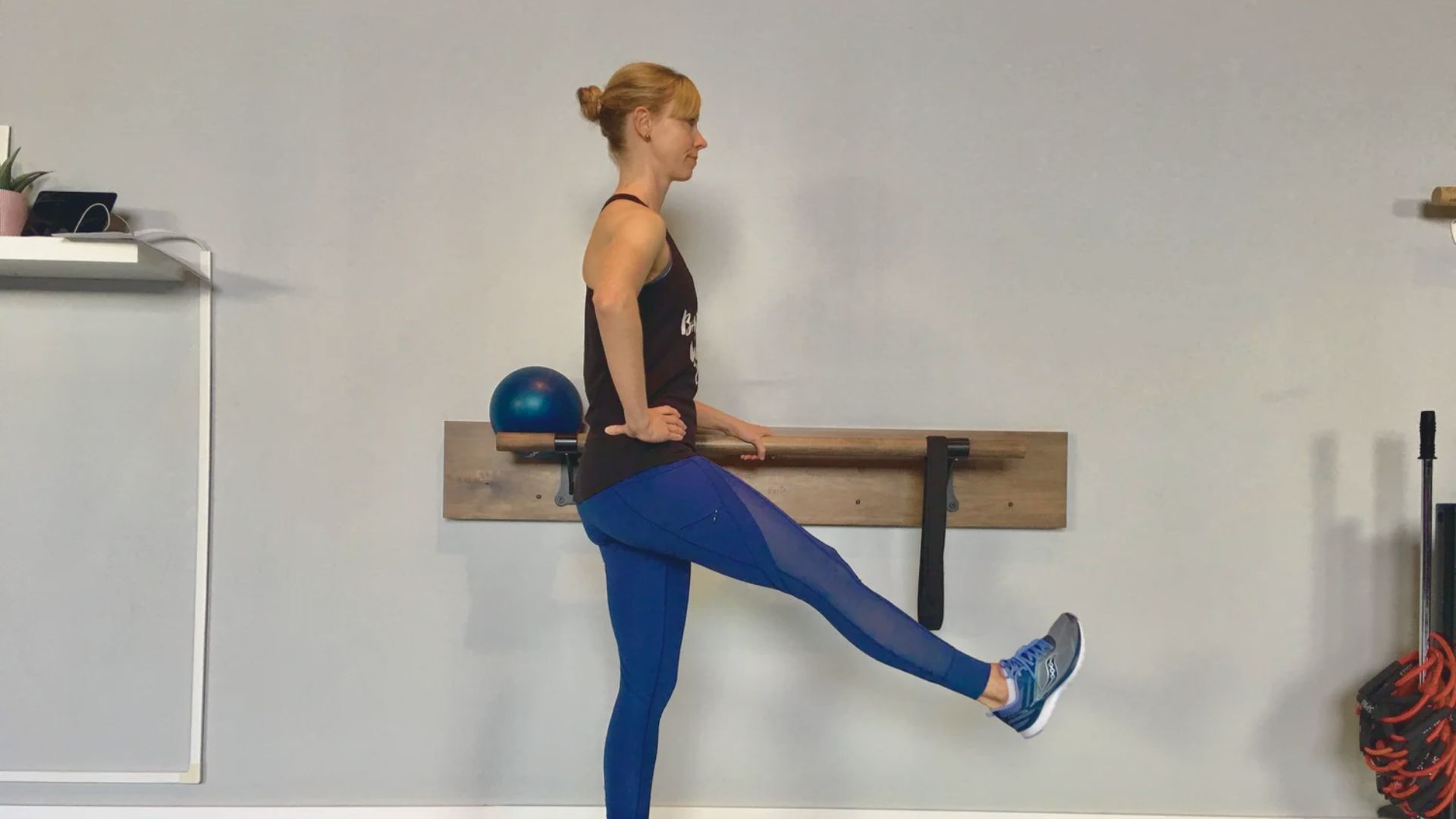 A woman is executing a leg workout , emphasizing her dedication to physical fitness and exercise.