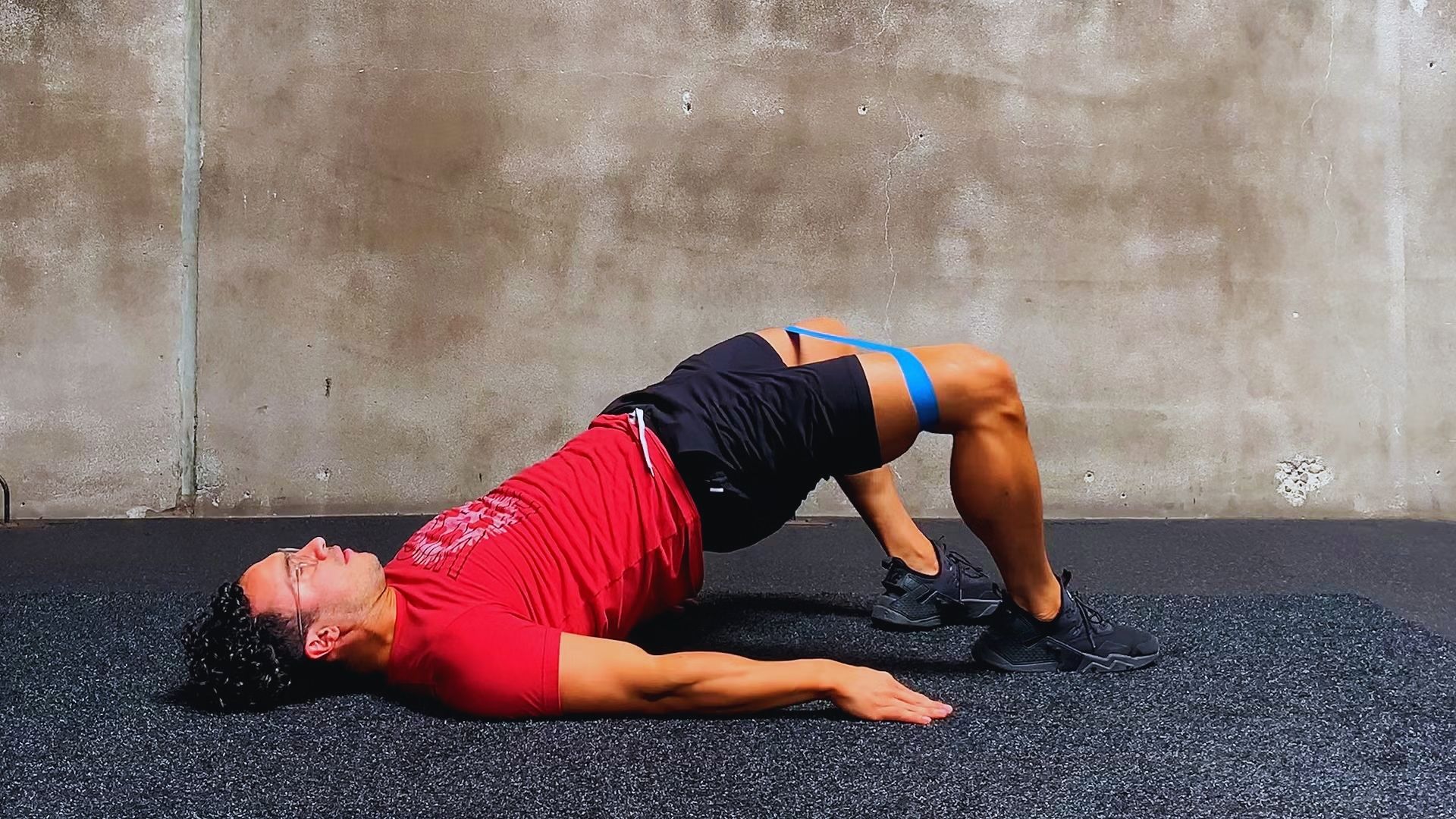 A man performing a push-up on a fitness mat, focusing on strength training and exercise form.