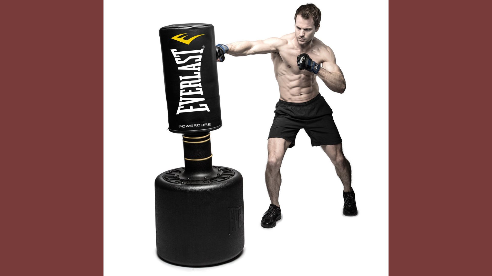 Black Everlast punching bag hanging from a ceiling, designed for boxing and fitness training.