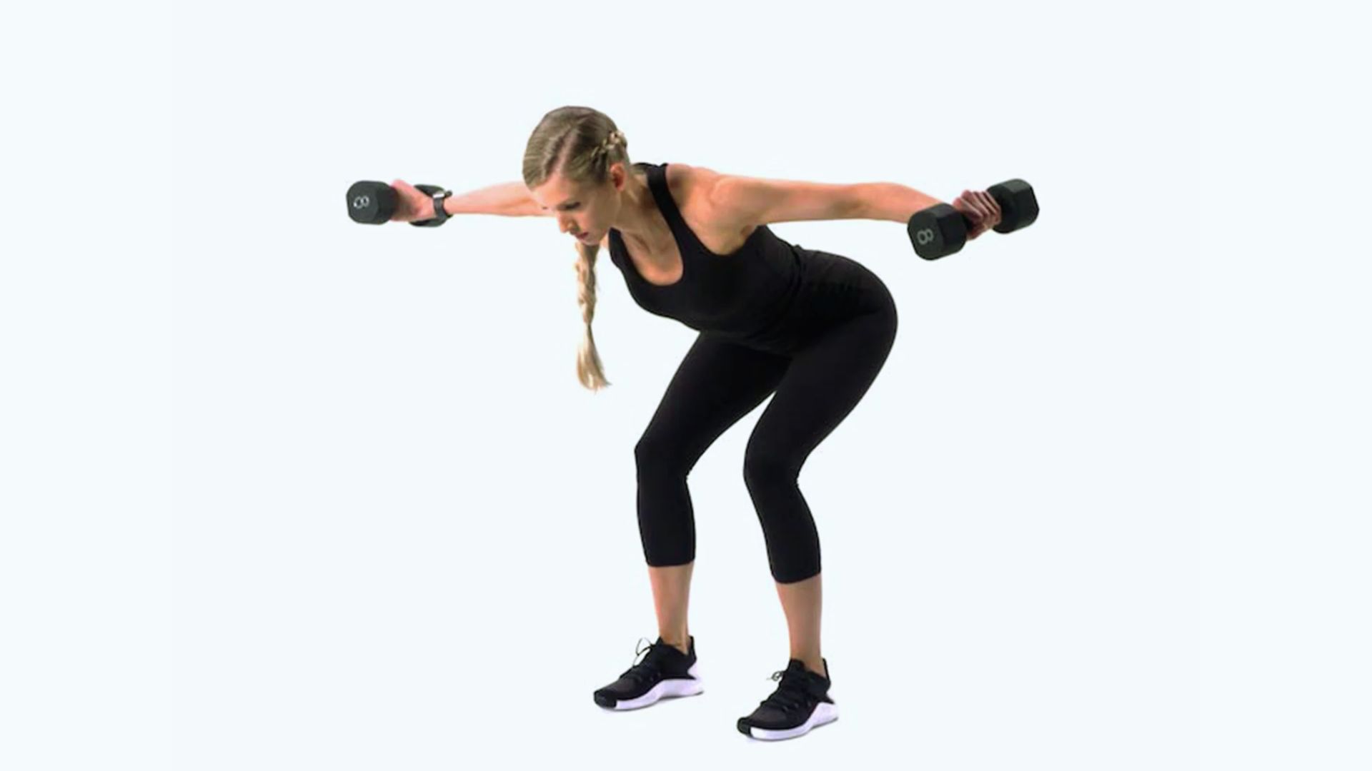 A woman with a braid performs a bent-over reverse fly exercise using dumbbells. She wears a black workout outfit and sneakers on a plain background.