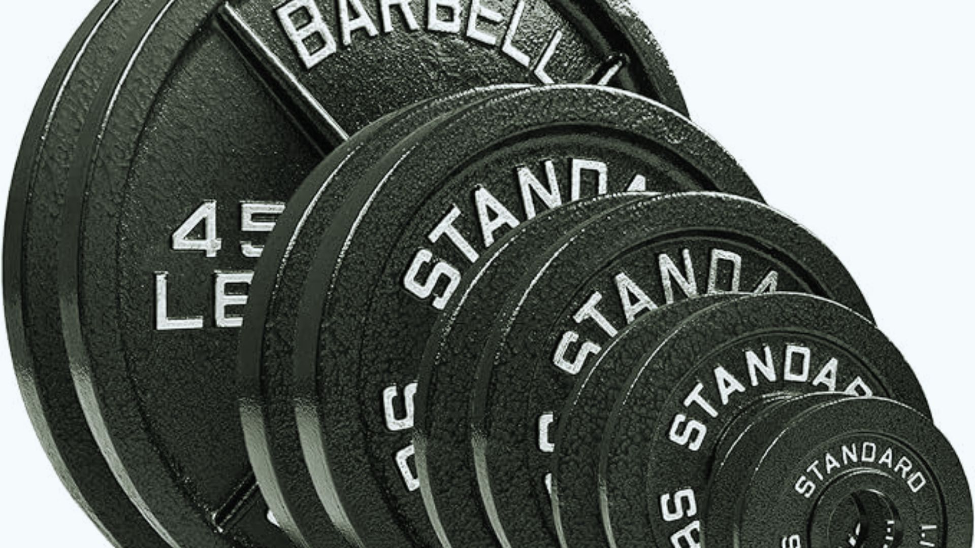 A stack of black barbell weight plates, varying in size, labeled “Standard” and “45 LB.” The plates are textured, conveying strength and fitness.