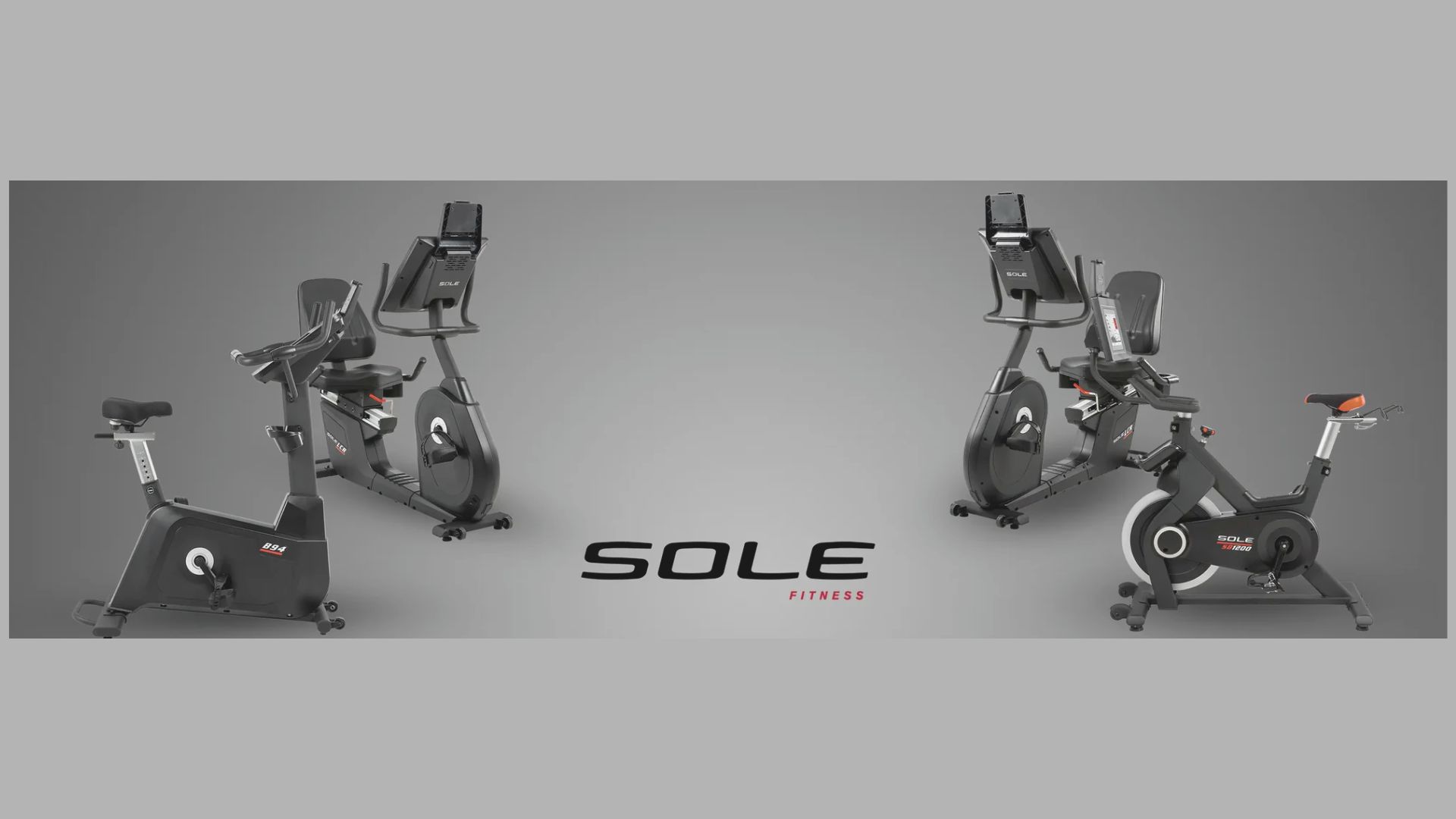 Four stationary exercise bikes are displayed against a gray background. The "SOLE Fitness" logo is centered below them, emphasizing modern design.