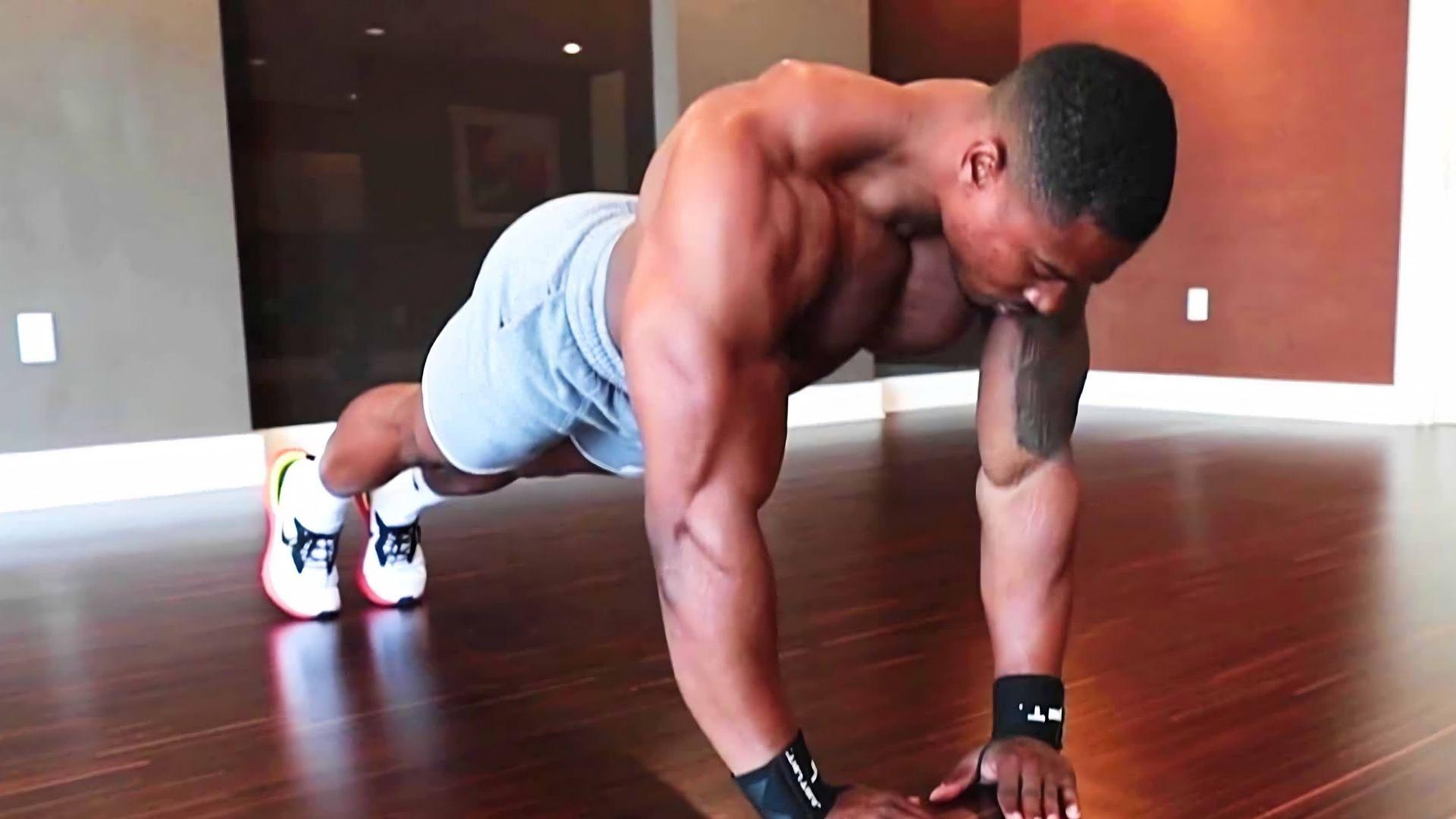 Person doing diamond pushups with hands in a diamond shape under the chest.