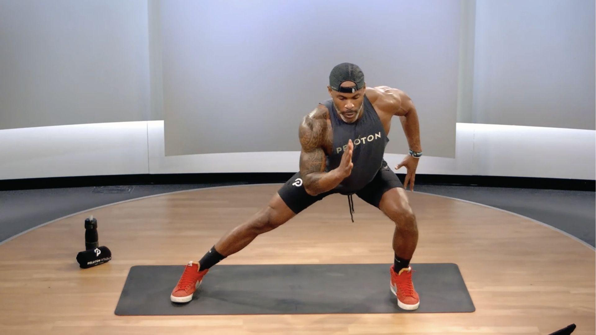 Man doing lateral lunges on mat to fire up glute medius, key muscles for hip stability