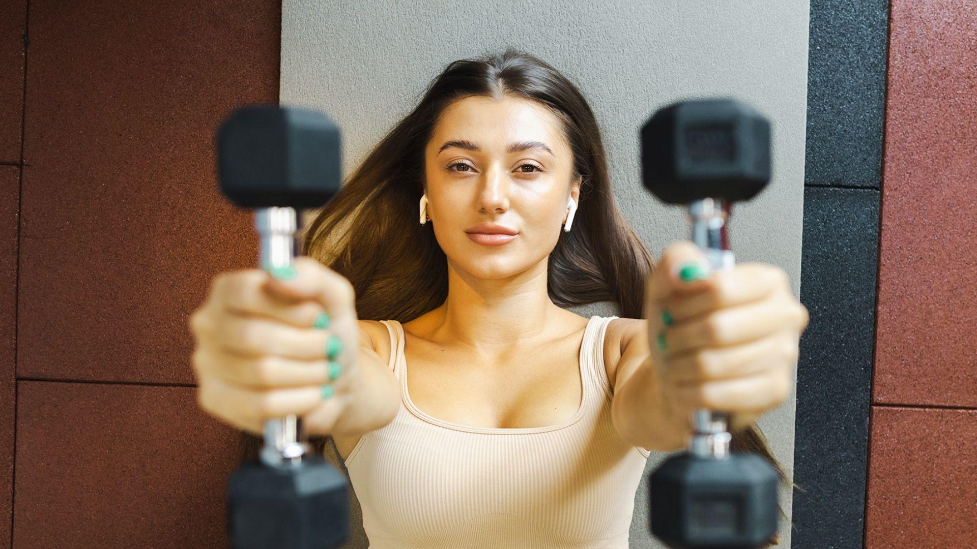 Dumbbells used in chest workout showing strength training for chest muscle growth and development