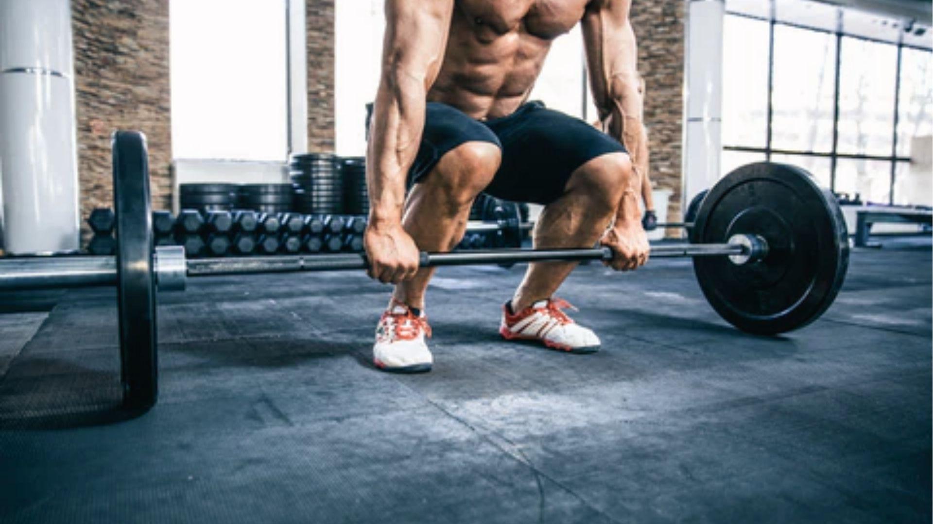 Woman lifting dumbbells to shoulders, demonstrating how resistance training targets fast-twitch fibers.