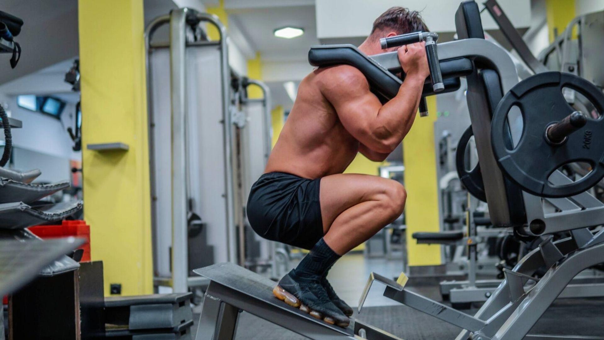A person performing Hack Squat Weight in the gym.