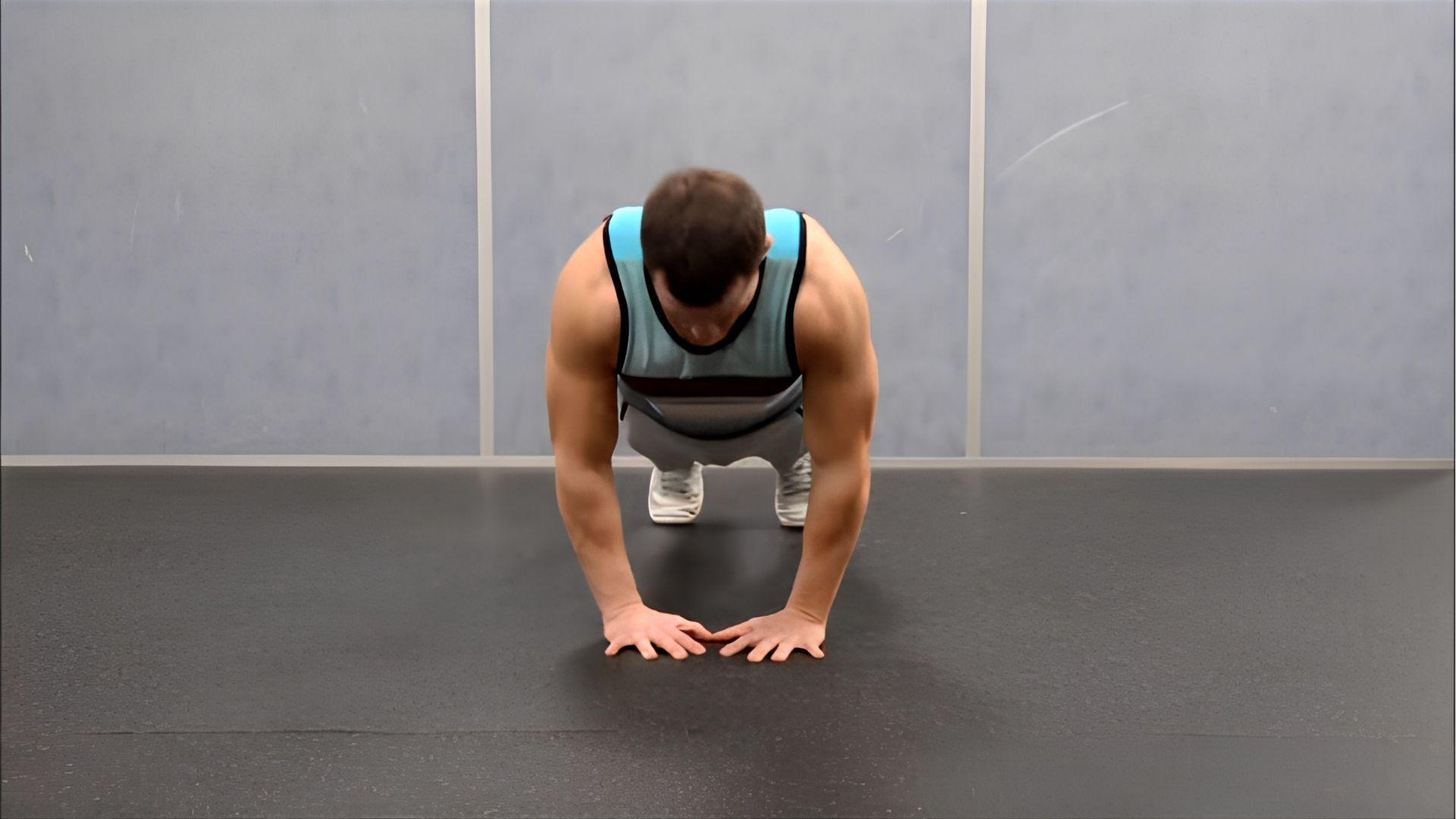 A person performing Diamond Pushups.