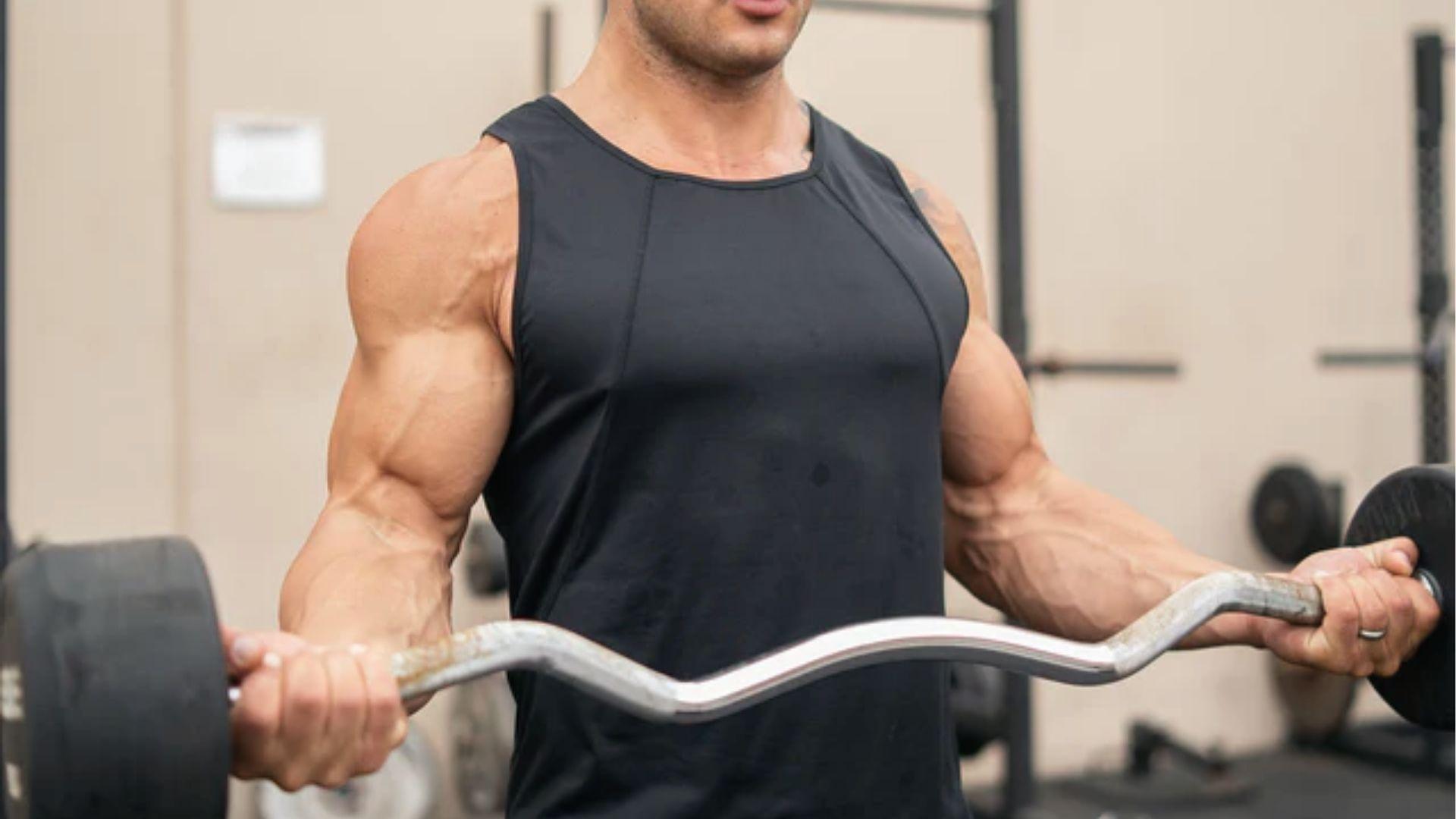 Defined arms curl EZ bar in gym, bro split biceps finisher for size and fullness