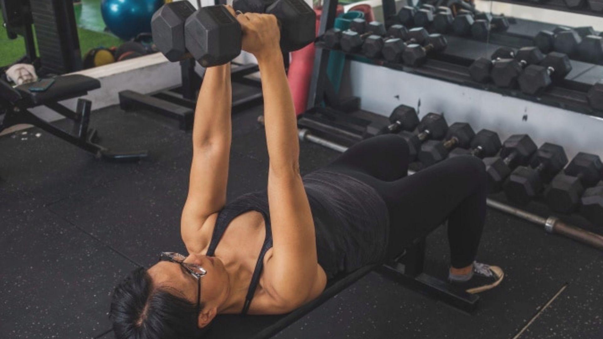 A girl performing Dumbbell Chest Exercises
