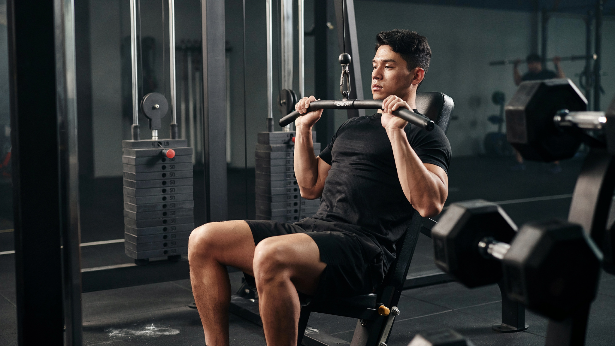 Close-grip lat pulldown targeting lower lats and back thickness.