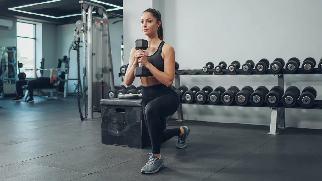 Returning to the starting position of a front foot elevated split squat.