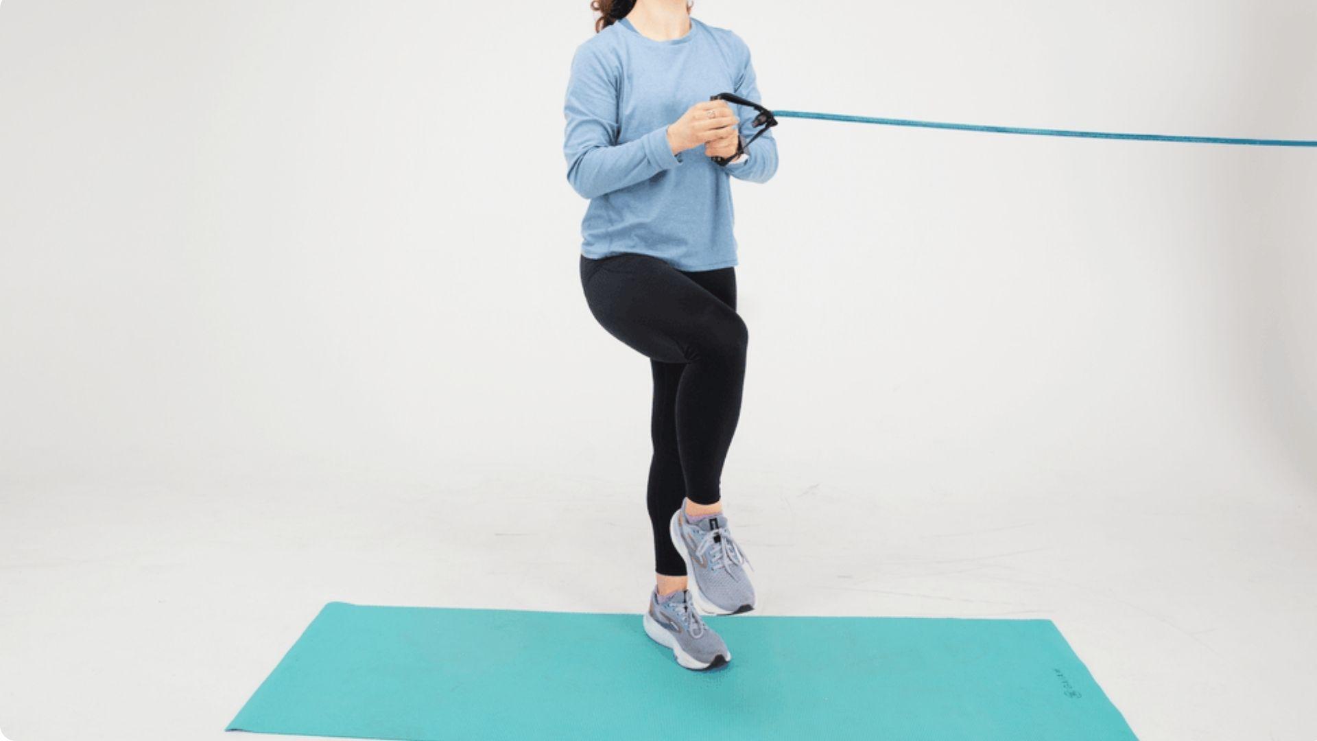 Single-leg balance exercise to enhance ankle stability and coordination on yoga mat.