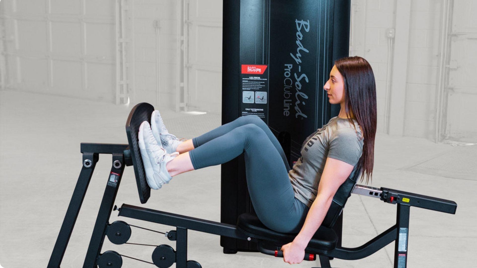 Gym-goer using a leg press machine, pushing the platform away to build lower-body strength and muscle.