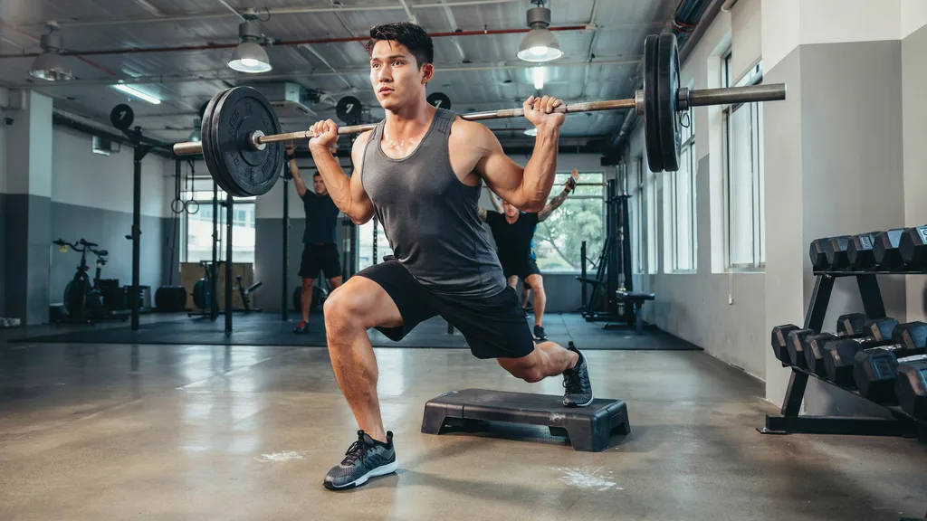 Driving upward through the front foot during a split squat.