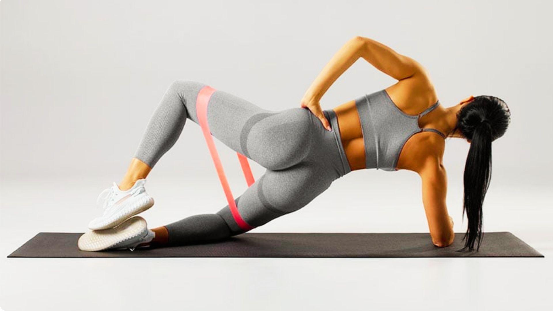 Resistance band clam shell exercise for strengthening glutes and improving hip stability