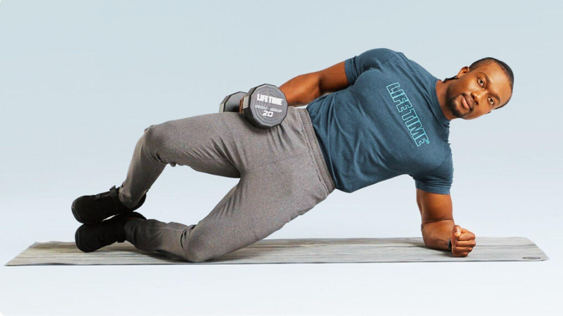 Weighted clam shell exercise with dumbbell for progressive glute strengthening