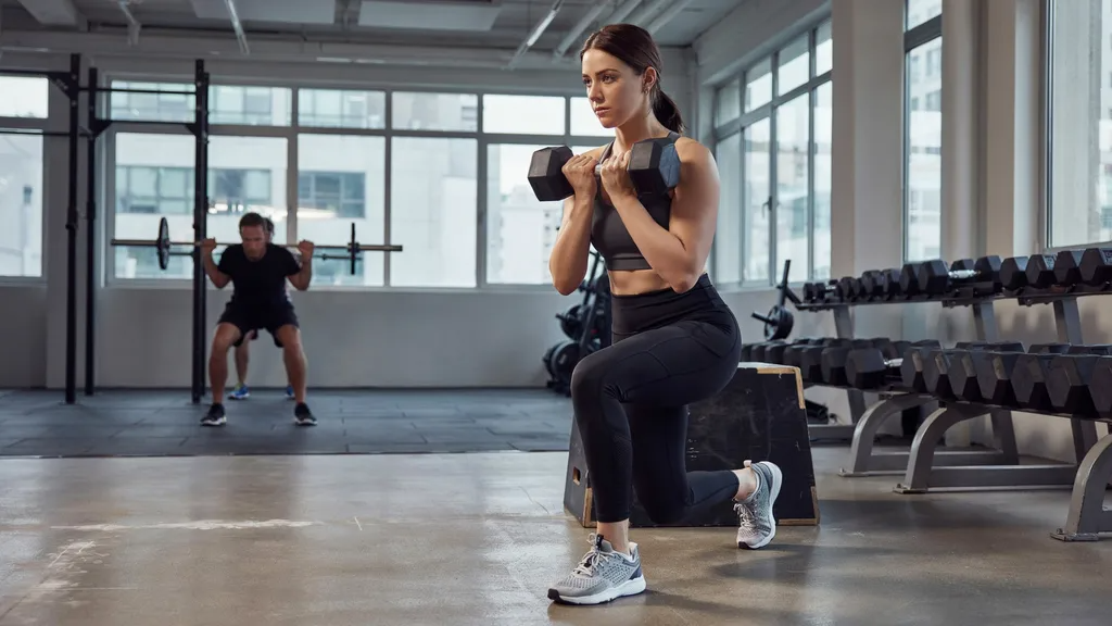 Controlled lowering phase of a front foot elevated split squat.
