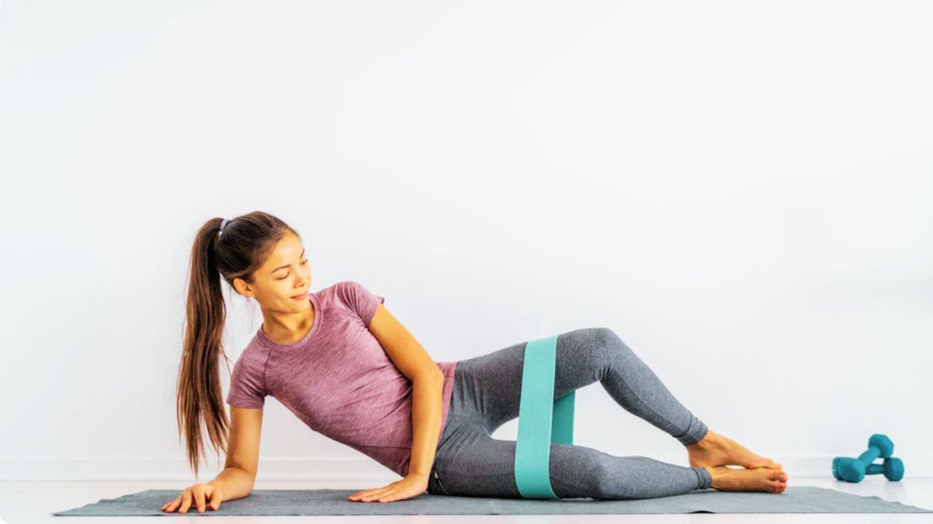 Mini band clam shell hold exercise for glute endurance and hip muscle activation