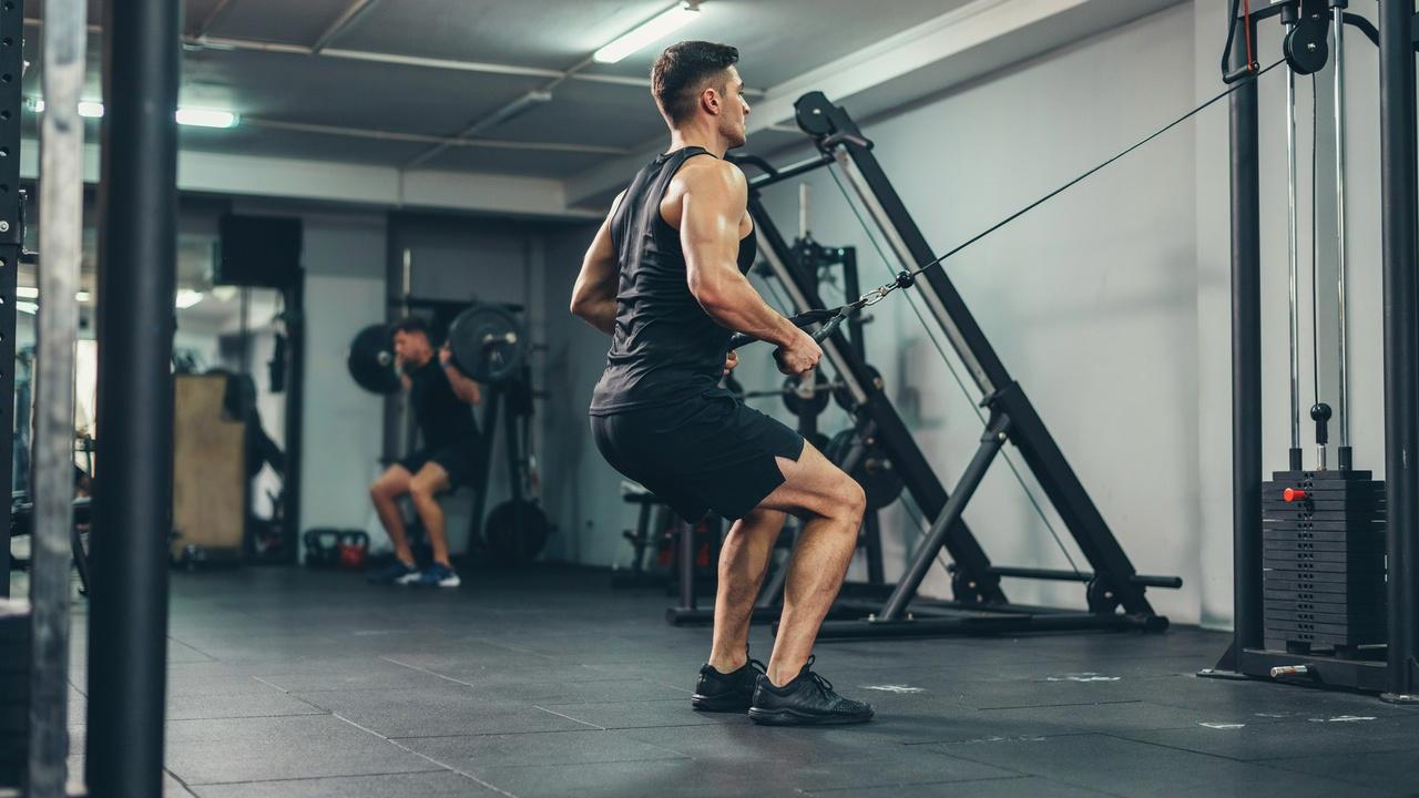 High cable row emphasizing upper back and rear shoulder muscles.