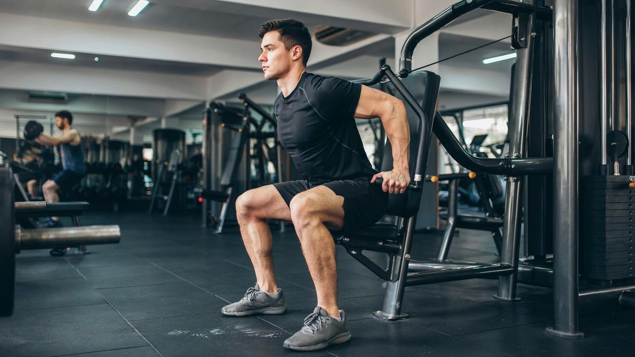 Single-arm cable row demonstrating unilateral back training.